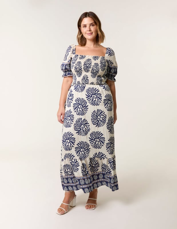 This dress is a must have in your holiday suitcase. This stunning printed maxi in refreshing pastel shades provides nothing but elegance. Match with sunny sandals.