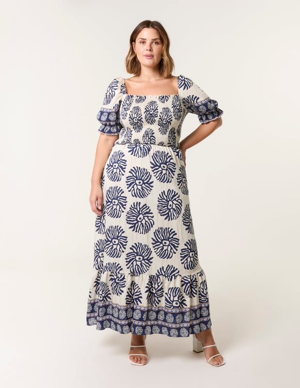 This dress is a must have in your holiday suitcase. This stunning printed maxi in refreshing pastel shades provides nothing but elegance. Match with sunny sandals.