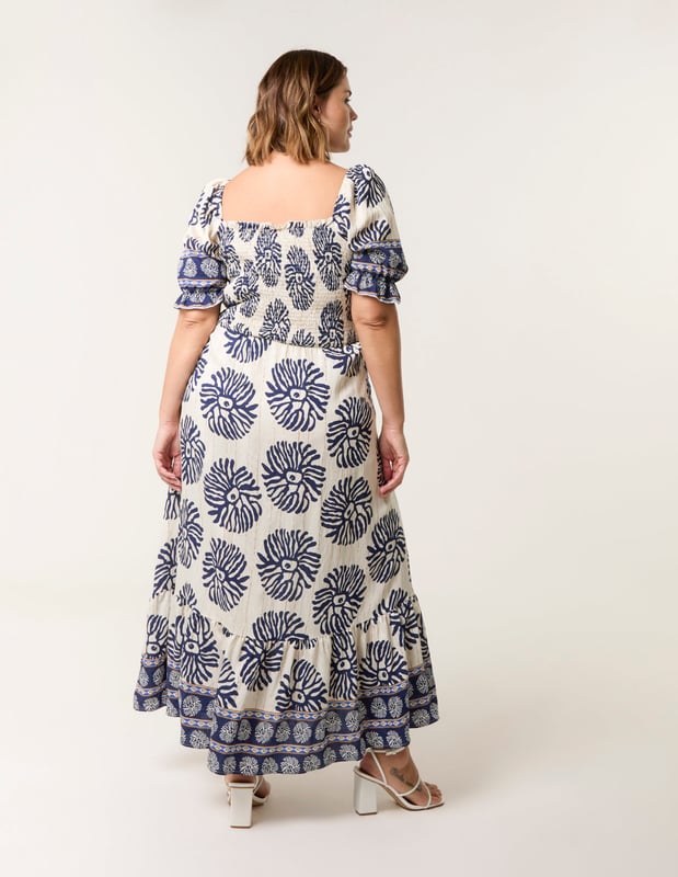 This dress is a must have in your holiday suitcase. This stunning printed maxi in refreshing pastel shades provides nothing but elegance. Match with sunny sandals.