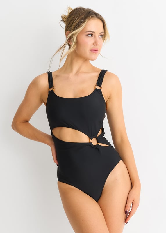 Embrace elegance with our Black Cut out Ring Detail Swimsuit. The sophisticated cut out design, accented with luxurious ring details, will make you stand out effortlessly. This swimsuit combines style and comfort, perfect for your next vacation or poolside occasion.