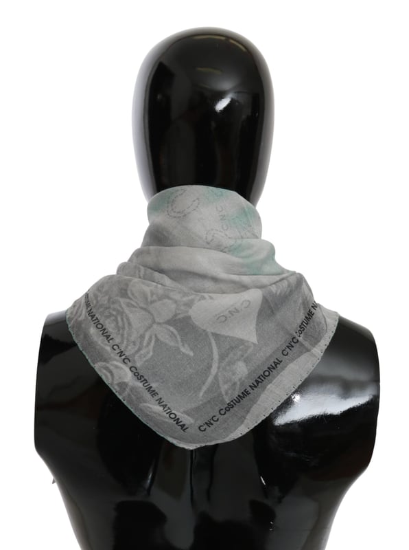 100% silk scarf from CNC Costume National
  Gray printed design
  Logo details
  Made in Italy
  Dimensions: 65cm x 65cm
  Suitable for women
Material: 100% Silk