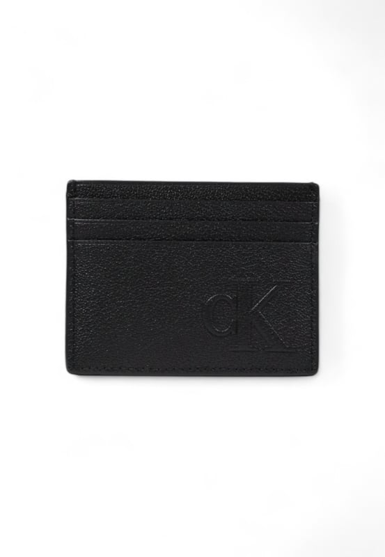Brand: Calvin Klein Jeans
  Gender: Men
  Type: Wallets
  Season: Spring/Summer
  Color: black
  Pattern: plain
  Size (cm): 8x10.5x0.5
  Article code: LV04G1024G
Material: Leather