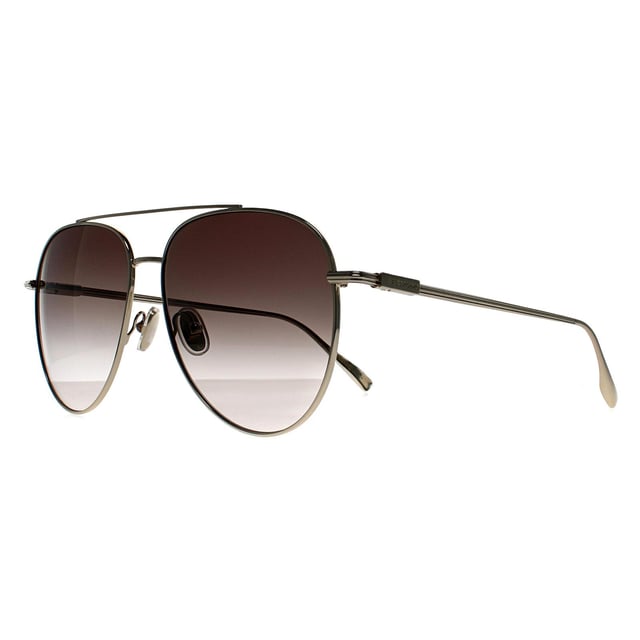 Salvatore Ferragamo Aviator Mens Light Gold Brown Gradient SF308S  Sunglasses feature a classic aviator shape with a refined metal frame and sleek double bridge. Designed with minimalist detailing and subtle Ferragamo branding at the temples, they offer full UV protection and a lightweight, comfortable fit â€“ ideal for a timeless, polished look.