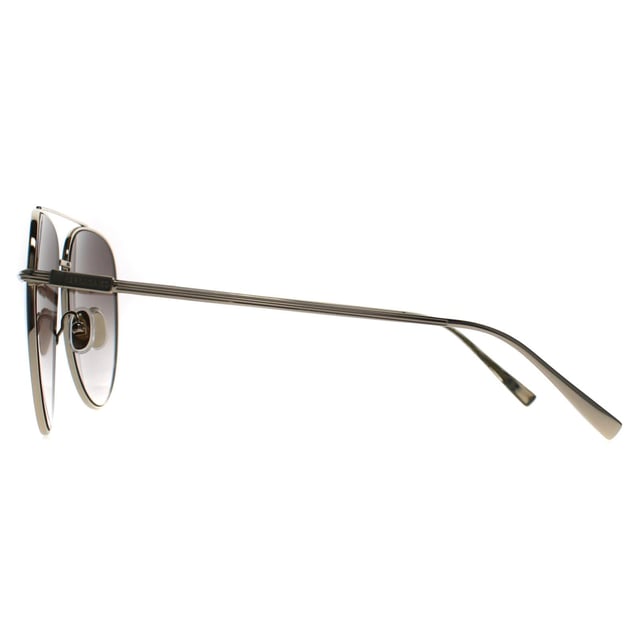 Salvatore Ferragamo Aviator Mens Light Gold Brown Gradient SF308S  Sunglasses feature a classic aviator shape with a refined metal frame and sleek double bridge. Designed with minimalist detailing and subtle Ferragamo branding at the temples, they offer full UV protection and a lightweight, comfortable fit â€“ ideal for a timeless, polished look.