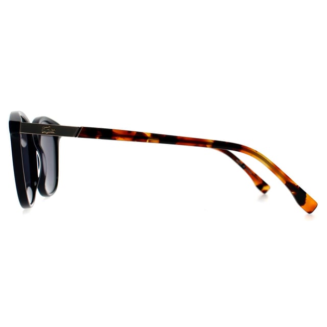 Lacoste Rectangle Unisex Blue Blue L961S Lacoste Rectangle Unisex Blue Blue L961S Sunglasses are a sleek embodiment of athletic elegance and modern style. Crafted for the unisex trendsetter, these sunglasses boast an all-blue aesthetic that harmoniously blends youthful energy with timeless sophistication. The lightweight plastic frames provide comfortable, all-day wear—ideal for those who balance sport and leisure effortlessly. Featuring category 3 lenses, they offer superior protection against bright sunlight while ensuring clear vision on or off the court. Subtle nods to Lacoste's iconic French heritage are visible in every detail, from the signature crocodile logo to their streamlined design inspired by classic tennis culture. Elevate your everyday look with eyewear that champions both performance and poised grace.