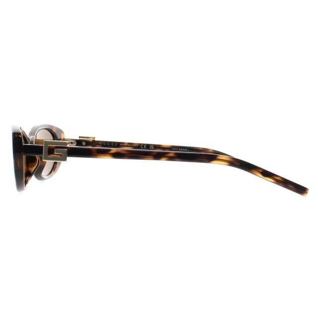 Gucci Cat Eye Womens Havana Brown GG1680S  Sunglasses are a luxurious blend of timeless elegance and contemporary style. Featuring a sleek, cat eye frame with bold lines, these sunglasses offer a sophisticated yet fashion-forward look. The high-quality lenses provide superb UV protection, shielding your eyes from harmful sun exposure while maintaining clear, crisp vision. Detailed with the iconic Gucci logo on the temples, the GG1680S sunglasses make a statement of high-end luxury and refinement. Whether you're lounging in the sun or out for a stylish outing, these sunglasses elevate any outfit with their distinctive, high-fashion appeal.