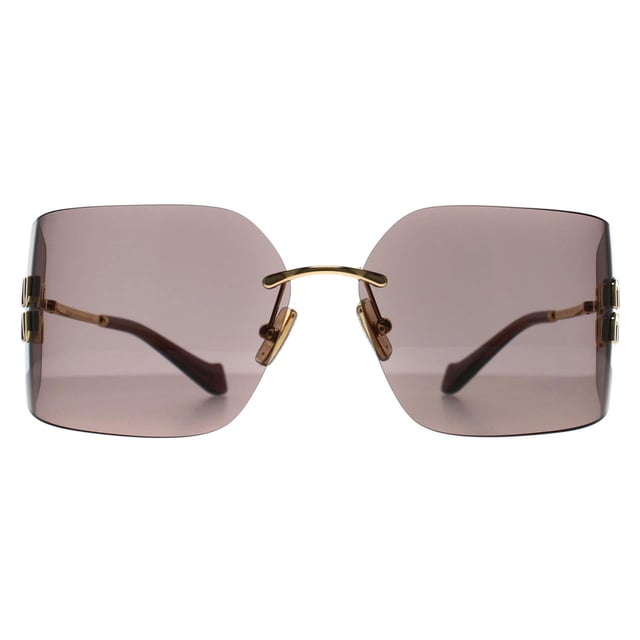 Las gafas de sol sin montura Miu Miu Gold Light Purple Brown MU54YS para mujer presentan una montura atrevida y sin montura que irradia confianza y sofisticación, fabricada en metal de alta calidad para ofrecer una sensación de lujo. Las lentes proporcionan una protección UV superior al tiempo que añaden un toque de glamour, perfecto para cualquier persona a la moda. Con detalles distintivos y el icónico logotipo de Miu Miu sutilmente grabado en las patillas, las gafas de sol MU54YS son un accesorio imprescindible para quienes se atreven a marcar tendencia. Sea el centro de atención y deje que su estilo brille con Miu Miu.