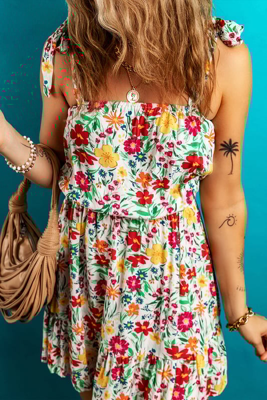Red floral print
  Knotted straps
  Cinched waist
  Ruffled hem
  Mini length
Material: 100% Viscose