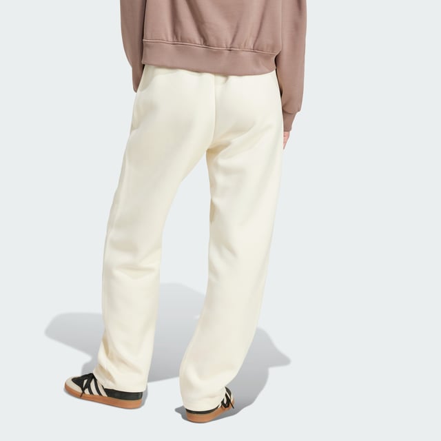 Remix your off-duty look with these adidas sweat pants. Inspired by martial arts and studio sports, they have a relaxed shape and a soft cotton-blend build that gives them an effortless vibe. Classic 3-Stripes on one leg add a signature finish to the casual design.By choosing recycled, adidas are able to reuse materials that have already been created, which helps to reduce waste. Renewable materials choices will help us to remove our reliance on finite resources. Our products made with a blend of recycled and renewable materials feature at least 70% total of these materials.  - Loose fit - Drawcord on elastic waist - 53% cotton, 47% polyester (recycled) - Side pockets - Contains a minimum of 70% recycled and renewable content  Shipped by adidas
