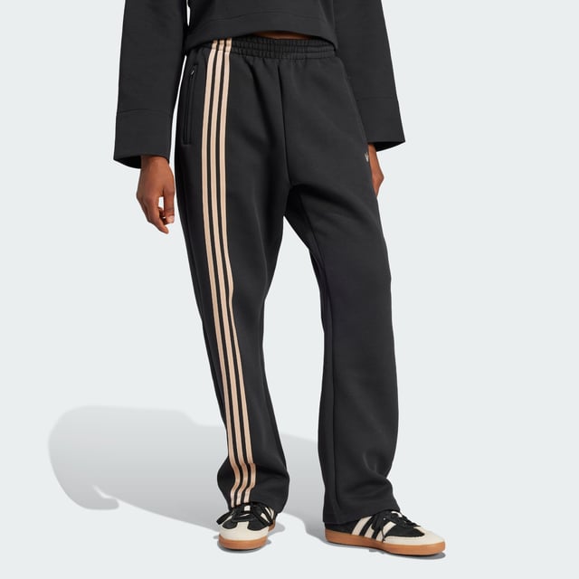 Remix your off-duty look with these adidas sweat pants. Inspired by martial arts and studio sports, they have a relaxed shape and a soft cotton-blend build that gives them an effortless vibe. Classic 3-Stripes on one leg add a signature finish to the casual design.By choosing recycled, adidas are able to reuse materials that have already been created, which helps to reduce waste. Renewable materials choices will help us to remove our reliance on finite resources. Our products made with a blend of recycled and renewable materials feature at least 70% total of these materials.  - Loose fit - Drawcord on elastic waist - 53% cotton, 47% polyester (recycled) - Side pockets - Contains a minimum of 70% recycled and renewable content  Shipped by adidas