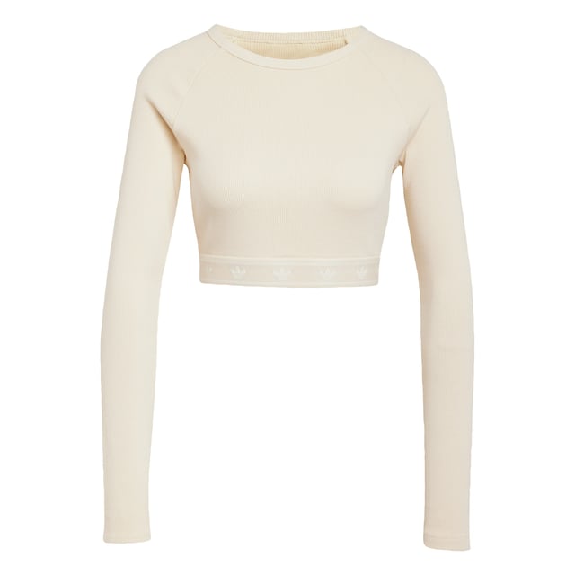 This adidas crop top is inspired by the bold attitudes and style of '90s hip hop. Soft ribbed fabric in a slim silhouette hugs the body while the long sleeves and crewneck give it a casual vibe. It's finished with a repeating Trefoil graphic along the hem.  - Slim fit with crop length - Crewneck - 95% cotton, 5% elastane  Shipped by adidas
