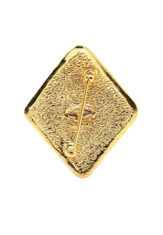 This brooch features a gold-tone metal body and a back pin closure.Brand: Chanel VintageCondition: PrelovedType: Costume BroochRating: B+Main Material: MetalDimensions (LxWxD): 5x4.2x0Comments: Exterior Back Scratched. Lock Scratched. Exterior Front Scratched.