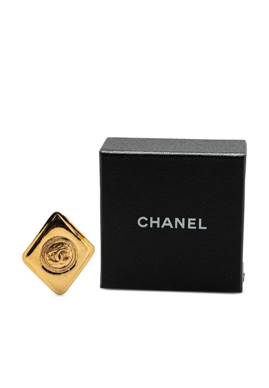This brooch features a gold-tone metal body and a back pin closure.Brand: Chanel VintageCondition: PrelovedType: Costume BroochRating: B+Main Material: MetalDimensions (LxWxD): 5x4.2x0Comments: Exterior Back Scratched. Lock Scratched. Exterior Front Scratched.