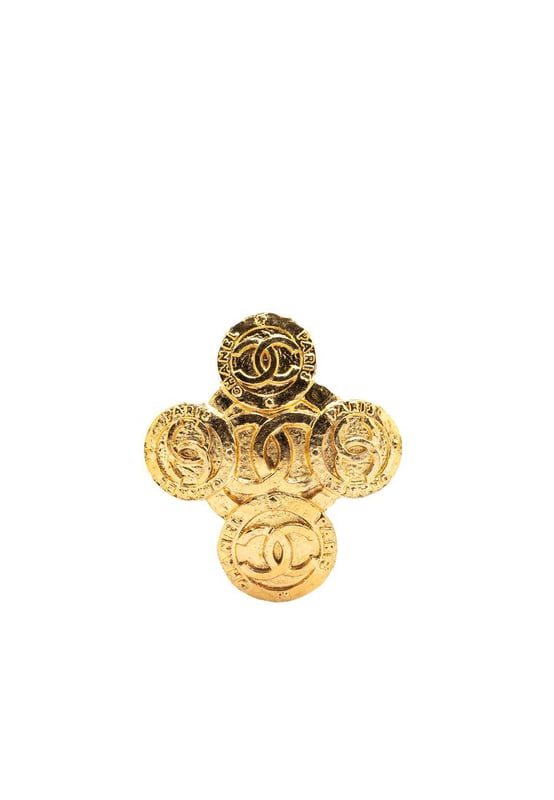 This brooch features a gold-tone metal body and a back pin closure.Brand: Chanel VintageCondition: PrelovedType: Costume BroochRating: B+Main Material: MetalDimensions (LxWxD): 6x5.2x0Comments: Exterior Back Discolored Scratched. Lock Scratched. Exterior Front Scratched.