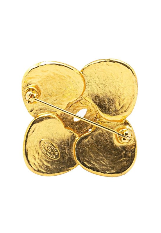 This brooch features a gold-tone metal body and a back pin closure.Brand: Chanel VintageCondition: PrelovedType: Costume BroochRating: B+Main Material: MetalDimensions (LxWxD): 4x4x0Comments: Exterior Back Scratched. Lock Scratched. Exterior Front Scratched.