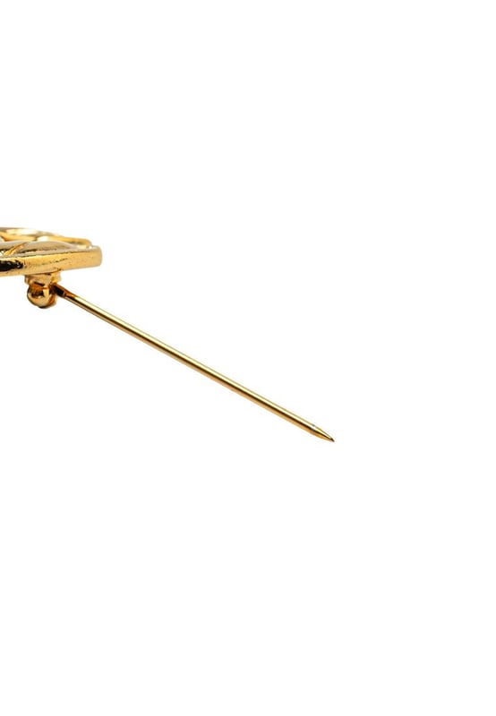 Pre-owned Chanel CC Logo Brooch This brooch features a quilted gold-plated body and a back pin closure.Brand: Chanel VintageCondition: PrelovedType: Costume BroochRating: B+Main Material: MetalDimensions (LxWxD): 3.4x4x0Comments: Exterior Back Scratched. Exterior Back stained with Other. Lock Scratched. Exterior Front Scratched.