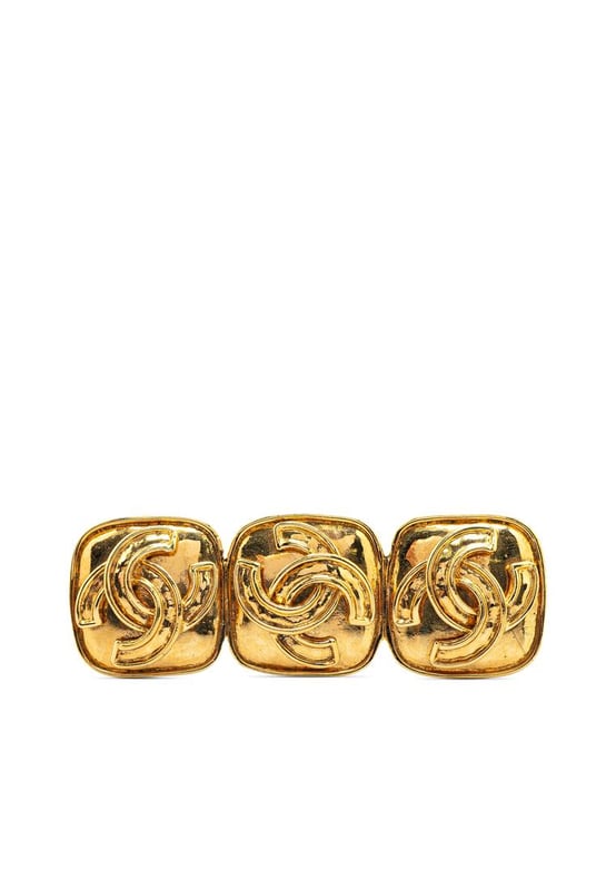 This brooch features a gold-tone metal body and a back pin closure.Brand: Chanel VintageCondition: PrelovedType: Costume BroochRating: B+Main Material: MetalDimensions (LxWxD): 2.3x7x0Comments: Exterior Back Scratched. Lock Scratched. Exterior Front Scratched.