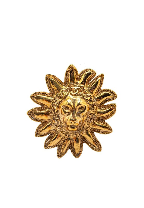 This brooch features a gold-plated metal body and back pin closure.Brand: Chanel VintageCondition: PrelovedType: Costume BroochRating: B+Main Material: MetalDimensions (LxWxD): 5.2x4.9x0Comments: Exterior Back Scratched. Lock Scratched. Exterior Front Scratched.
