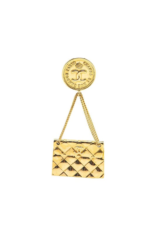 This brooch features a metal body and a back pin closure.Brand: Chanel VintageCondition: PrelovedType: Costume BroochRating: B+Main Material: MetalDimensions (LxWxD): 8x3.5x0Comments: Exterior Back Scratched. Lock Scratched. Exterior Front Scratched.
