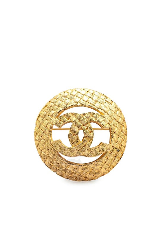 This brooch features a gold-tone metal body and a back pin closure.Brand: Chanel VintageCondition: PrelovedType: Costume BroochRating: B+Main Material: MetalDimensions (LxWxD): 3.6x3.6x0Comments: Exterior Back Discolored Scratched. Lock Scratched.