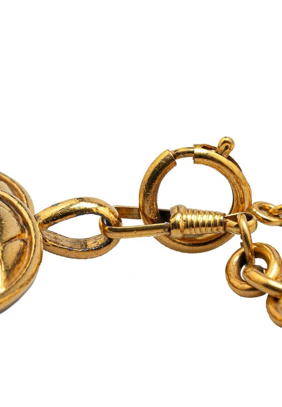 This necklace features a gold-tone chain a gold-tone quilted CC pendant and a spring ring closure.Brand: Chanel VintageCondition: PrelovedType: Costume NecklaceRating: B+Main Material: MetalDimensions (LxWxD): 84.3x4.2x0Comments: Exterior Back Scratched. Lock Scratched. Exterior Front Scratched. Exterior Front stained with Other. Exterior Handle Scratched.
