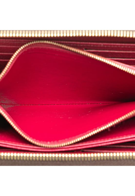 This wallet features a monogram canvas body a zip-around closure and interior zip and slip pockets.Brand: Louis Vuitton VintageCondition: PrelovedType: Long WalletsRating: B+Main Material: CanvasDimensions (LxWxD): 10x19x2.5Comments: Exterior Bottom Worn. Exterior Corners Worn. Interior Pocket stained with Other. Interior Lining Worn. Exterior Side Worn. Exterior Top Worn. Zipper Rusty/Tarnished Scratched.