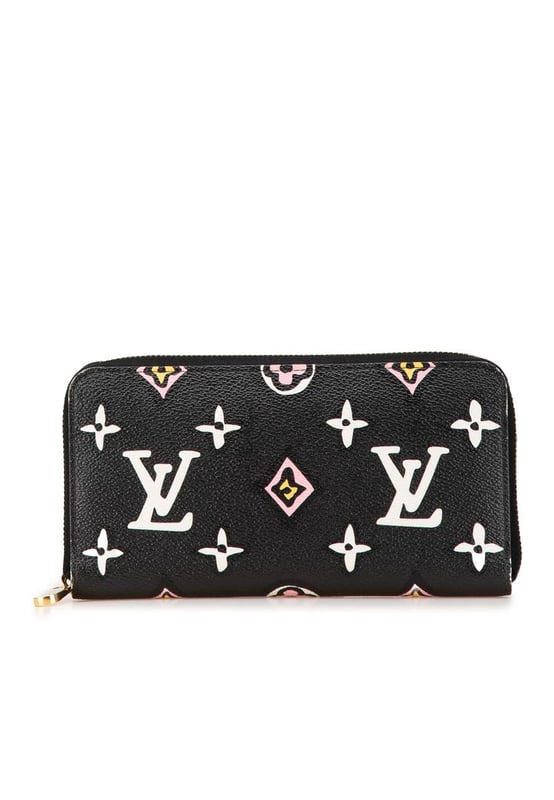 This long wallet features a monogram canvas body a zip around closure and interior zip and slip compartments.Brand: Louis Vuitton VintageCondition: PrelovedType: Long WalletsRating: ABMain Material: CanvasDimensions (LxWxD): 10.5x19.5x2.5Comments: Exterior Corners Worn. Interior Pocket stained with Other. Interior Lining Worn. Interior Lining stained with Other. Exterior Side Worn. Exterior Top Worn. Zipper Rusty/Tarnished Scratched.