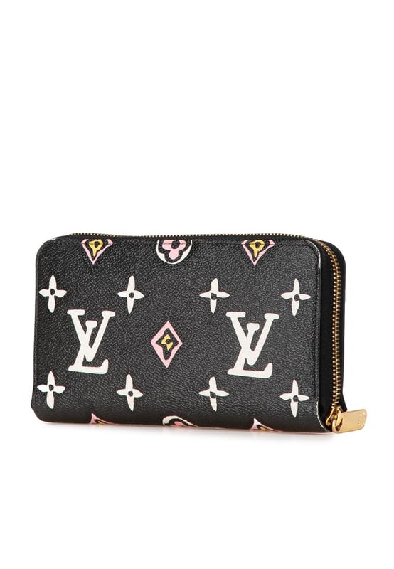 This long wallet features a monogram canvas body a zip around closure and interior zip and slip compartments.Brand: Louis Vuitton VintageCondition: PrelovedType: Long WalletsRating: ABMain Material: CanvasDimensions (LxWxD): 10.5x19.5x2.5Comments: Exterior Corners Worn. Interior Pocket stained with Other. Interior Lining Worn. Interior Lining stained with Other. Exterior Side Worn. Exterior Top Worn. Zipper Rusty/Tarnished Scratched.