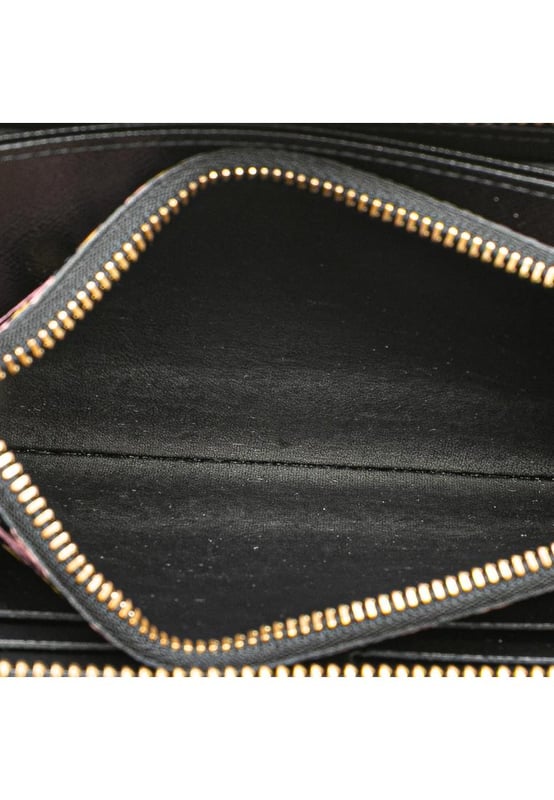 This long wallet features a monogram canvas body a zip around closure and interior zip and slip compartments.Brand: Louis Vuitton VintageCondition: PrelovedType: Long WalletsRating: ABMain Material: CanvasDimensions (LxWxD): 10.5x19.5x2.5Comments: Exterior Corners Worn. Interior Pocket stained with Other. Interior Lining Worn. Interior Lining stained with Other. Exterior Side Worn. Exterior Top Worn. Zipper Rusty/Tarnished Scratched.