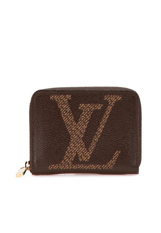 This coin purse features a monogram giant canvas body a zip-around closure and interior slip compartments.Brand: Louis Vuitton VintageCondition: PrelovedType: Coin PouchRating: ABMain Material: CanvasDimensions (LxWxD): 8.5x11x2Dust Bag: YesComments: Exterior Corners Worn. Interior Lining Worn. Interior Lining stained with Other. Exterior Top Worn. Zipper Scratched.