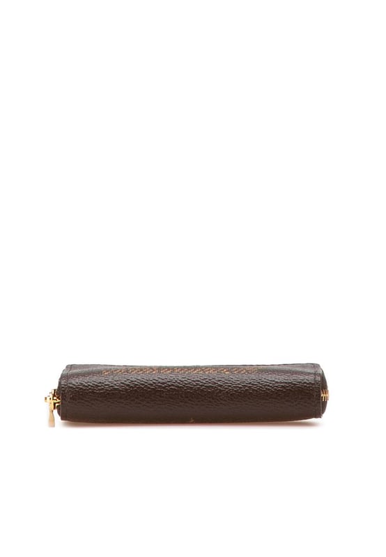 This coin purse features a monogram giant canvas body a zip-around closure and interior slip compartments.Brand: Louis Vuitton VintageCondition: PrelovedType: Coin PouchRating: ABMain Material: CanvasDimensions (LxWxD): 8.5x11x2Dust Bag: YesComments: Exterior Corners Worn. Interior Lining Worn. Interior Lining stained with Other. Exterior Top Worn. Zipper Scratched.