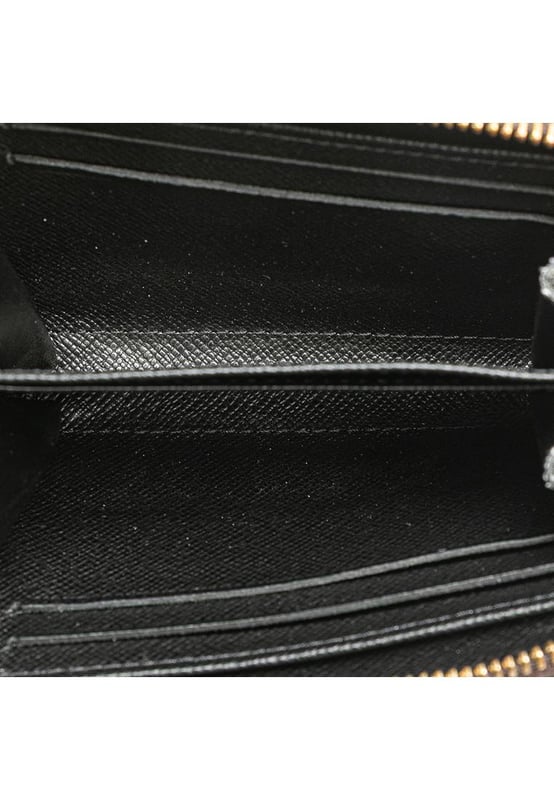 This coin purse features a monogram giant canvas body a zip-around closure and interior slip compartments.Brand: Louis Vuitton VintageCondition: PrelovedType: Coin PouchRating: ABMain Material: CanvasDimensions (LxWxD): 8.5x11x2Dust Bag: YesComments: Exterior Corners Worn. Interior Lining Worn. Interior Lining stained with Other. Exterior Top Worn. Zipper Scratched.