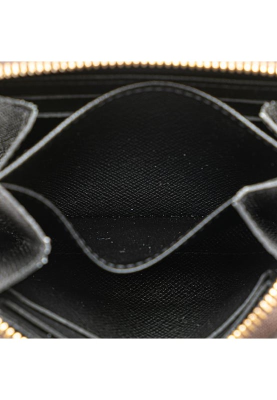 This coin purse features a monogram giant canvas body a zip-around closure and interior slip compartments.Brand: Louis Vuitton VintageCondition: PrelovedType: Coin PouchRating: ABMain Material: CanvasDimensions (LxWxD): 8.5x11x2Dust Bag: YesComments: Exterior Corners Worn. Interior Lining Worn. Interior Lining stained with Other. Exterior Top Worn. Zipper Scratched.