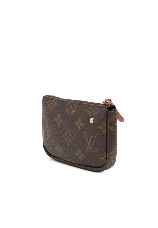 The Pochette Cles features a printed monogram canvas body and a top zip closure.Brand: Louis Vuitton VintageCondition: PrelovedType: Coin PouchRating: B+Main Material: CanvasDimensions (LxWxD): 9.5x15x3Handle Drop: 13Comments: Interior Lining Loose Stitching. Practical Attachment Scratched. Exterior Top Loose Stitching. Zipper Rusty/Tarnished.