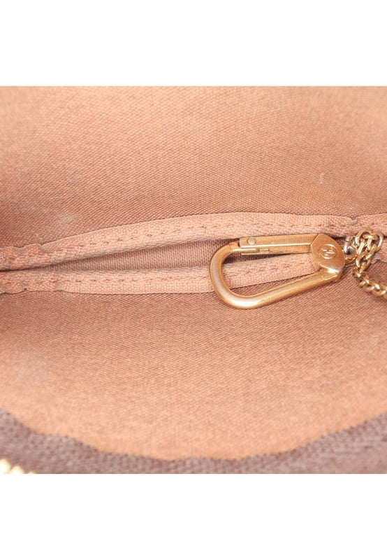 The Pochette Cles features a printed monogram canvas body and a top zip closure.Brand: Louis Vuitton VintageCondition: PrelovedType: Coin PouchRating: B+Main Material: CanvasDimensions (LxWxD): 9.5x15x3Handle Drop: 13Comments: Interior Lining Loose Stitching. Practical Attachment Scratched. Exterior Top Loose Stitching. Zipper Rusty/Tarnished.