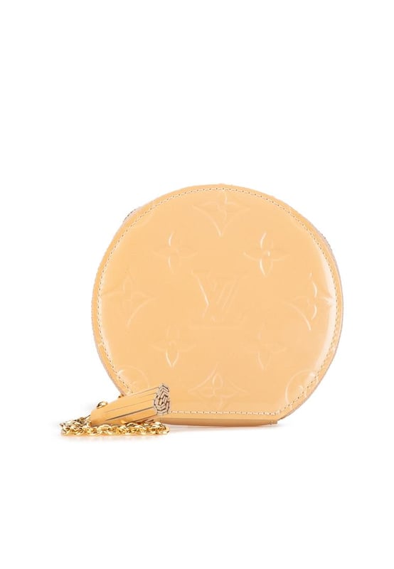 This coin pouch features a monogram vernis leather body a top zip closure and a gold-tone chain link strap with a leather tassel.Brand: Louis Vuitton VintageCondition: PrelovedType: Coin PouchRating: B+Main Material: LeatherDimensions (LxWxD): 10x11x1.5Dust Bag: YesComments: Exterior Bottom stained with Other. Embellishment Scratched. Interior Lining Scratched. Interior Lining stained with Other. Zipper Scratched.