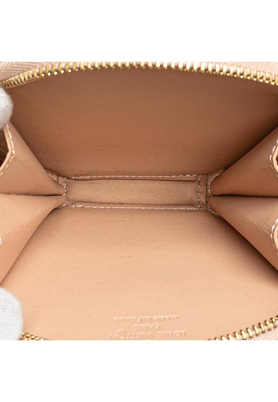 This coin pouch features a monogram vernis leather body a top zip closure and a gold-tone chain link strap with a leather tassel.Brand: Louis Vuitton VintageCondition: PrelovedType: Coin PouchRating: B+Main Material: LeatherDimensions (LxWxD): 10x11x1.5Dust Bag: YesComments: Exterior Bottom stained with Other. Embellishment Scratched. Interior Lining Scratched. Interior Lining stained with Other. Zipper Scratched.