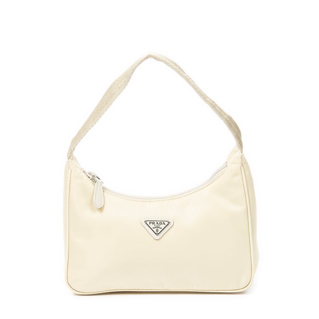 Prada Taschen Vintage Mini Zip Hobo  Umhängetasche und Elfenbein Leinwand und Silber hardware. Das Produkt ist auf in ausgezeichnetem Zustand (A).
  Abmessungen: 21x19x8 cm 
  Zubehör inklusive: Clotchette
  Hinweise zu Riemen/Griff: Leicht abgenutzt
  BrandCo Paris hat seltene Artikel und die besten Konditionen zu unglaublichen Preisen vorgestellt. Geduld lohnt sich! Kaufen Sie mit Vertrauen: Alle Artikel von BrandCo Paris sind von unserem Expertenteam ausgewählt und authentisch.
  Alle Artikel enthalten ein Echtheitszertifikat und wurden von BrandCo Paris übernommen.
  Tabelle zur Klassifizierung des Artikelzustands
  N (wie neu)
  AA (perfekter Zustand)
  A (ausgezeichneter Zustand)
  AB (sehr guter Zustand)
  B (gut/mittelmäßig)
