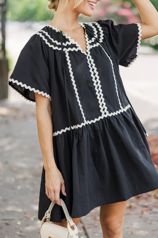 Our styles are designed with a trendy fitted look in mind following an international size standard. For the best fit we suggest choosing one size up from your usual. Be sure to check our sizing chart to find your perfect match!
  Vibrant contrast ricrac trim adds a playful touch
  Flattering V
  neck and short sleeves for a chic look
  Loose fit provides comfort and easy movement
  Mini length showcases a flirty and stylish silhouette
Material: 100% Cotton