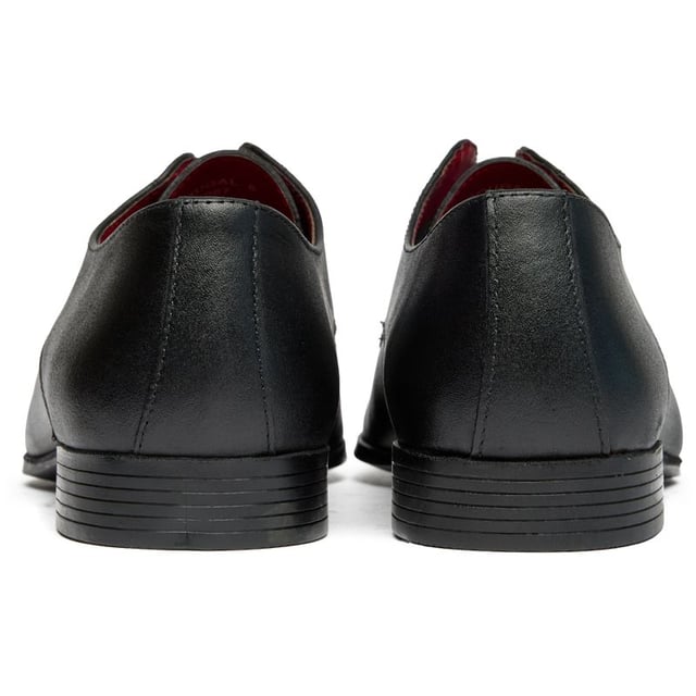 Mens black Lambretta dougal shoes, manufactured with leather and a pvc sole. Featuring: leather upper, stitched tramlines, sleek design, mod inspired and shoe bags.