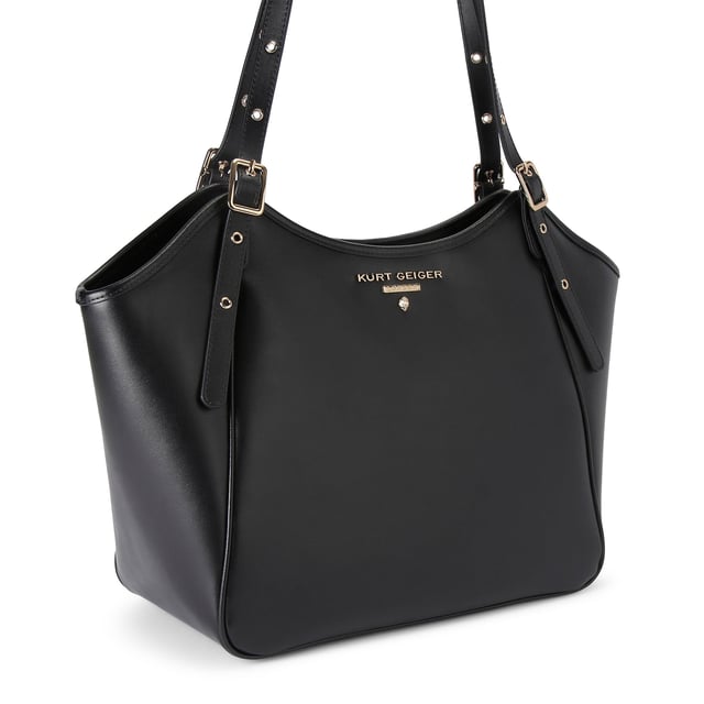This Kurt Geiger Angel Tote Bag is crafted from a soft black leather. There are two top handles which can be adjusted by gold buckles. There is gold branding on the front above an eagle head. Dimensions: 27cm (H), 32cm (L), 15cm (D). Shoulder strap length: 64cm.