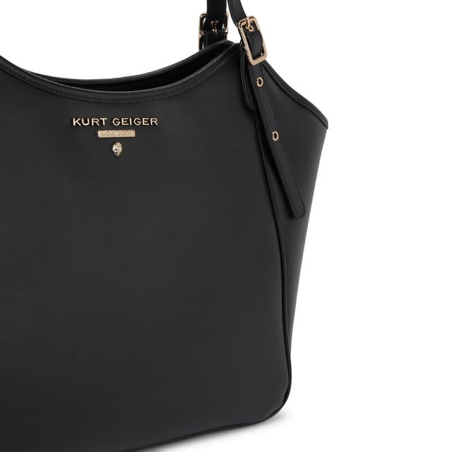 This Kurt Geiger Angel Tote Bag is crafted from a soft black leather. There are two top handles which can be adjusted by gold buckles. There is gold branding on the front above an eagle head. Dimensions: 27cm (H), 32cm (L), 15cm (D). Shoulder strap length: 64cm.