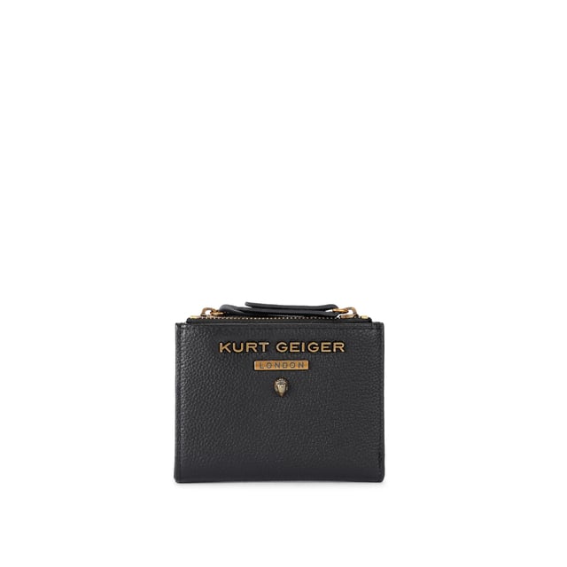The Greenwich Mini Purse features a black grained leather exterior. There is an antiqued brass eagle head and branding on the front. 9cm (H), 11cm (L), 2cm (D).