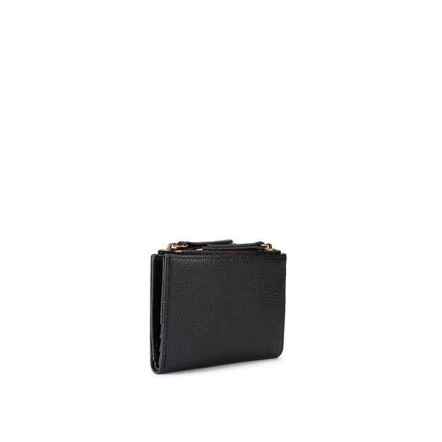 The Greenwich Mini Purse features a black grained leather exterior. There is an antiqued brass eagle head and branding on the front. 9cm (H), 11cm (L), 2cm (D).