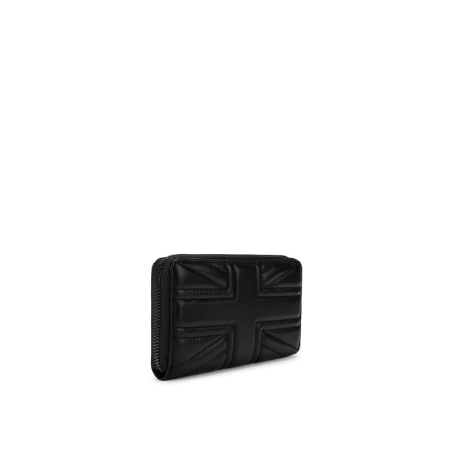 This Kurt Geiger Union Jack Drench Zip Around Purse features a black leather exterior with overstitch quilting creating a Union Jack design. There is a black eagle head with crystals on the front. Dimensions: 10cm (H), 19cm (L), 2cm (D).