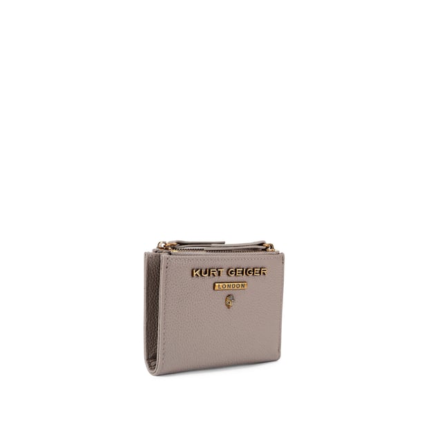 The Greenwich Mini Purse features a taupe grained leather exterior. There is an antiqued brass eagle head and branding on the front. 9cm (H), 11cm (L), 2cm (D).