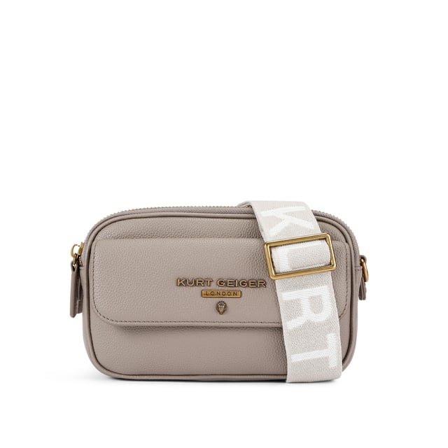This Kurt Geiger 2Zip Greenwich Cross Body bag is crafted in a taupe grained leather. There is a flat pocket on the back and a magnetic snap closure pocket on the front. There is antiqued brass branding on the front flap. Dimensions: 14cm (H), 23cm (L), 7cm(D). Strap length: 132cm.