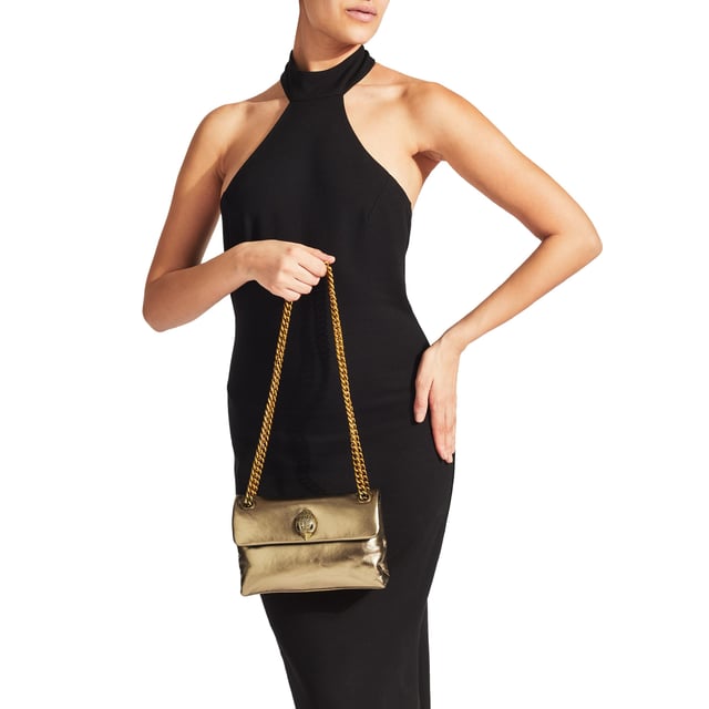 The KGL Mini Kew Bag is crafted from a smooth lambskin leather. The gold-coloured metal eagle head features crystals on the front flap. 14cm (H), 20cm (L), 6cm (D). Strap drop cross body: 120cm. Strap drop shoulder: 70cm.