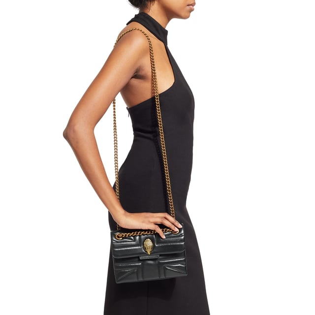 The Kurt Geiger Kensington Union Jack bag is crafted from a soft lambskin leather with stitched Union Jack design. The antiqued brass eagle head features crystals on the front flap. 14cm (H), 20cm (L), 6cm (D) Strap drop cross body: 120cm Strap drop shoulder: 70cm