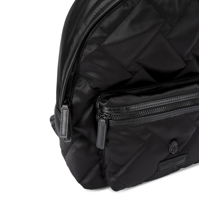 This Nylon Drench backpack arrives in black with overstitch quilted design. There is a black eagle head on the large front pocket. 34cm (H), 26cm (L), 12cm (D). Strap lengths: 85cm.